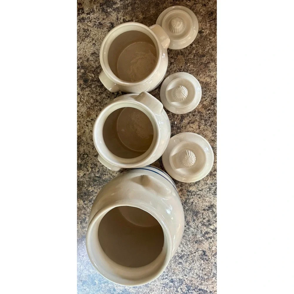 Complete set of Robinson Ransbottom canisters (1 pint, 1 qt, 2 qt).
